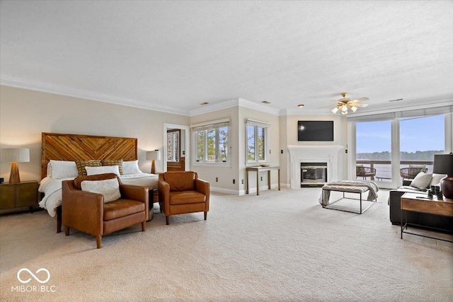 11715 Landings Dr, Indianapolis, IN 46256 - bedroom with ornamental molding, light carpet, a glass covered fireplace, baseboards, and access to exterior