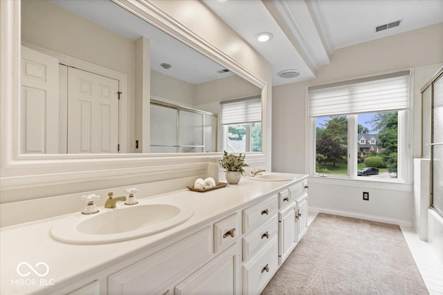 11715 Landings Dr, Indianapolis, IN 46256 - bathroom featuring double vanity, a shower with shower door, and baseboards
