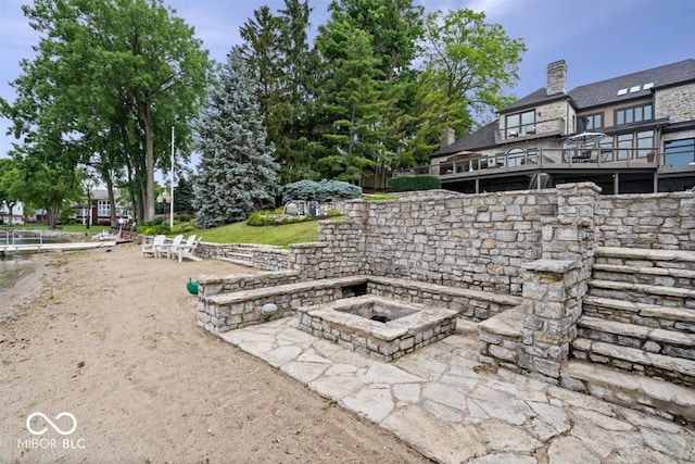 11715 Landings Dr, Indianapolis, IN 46256 - view of patio featuring an outdoor fire pit