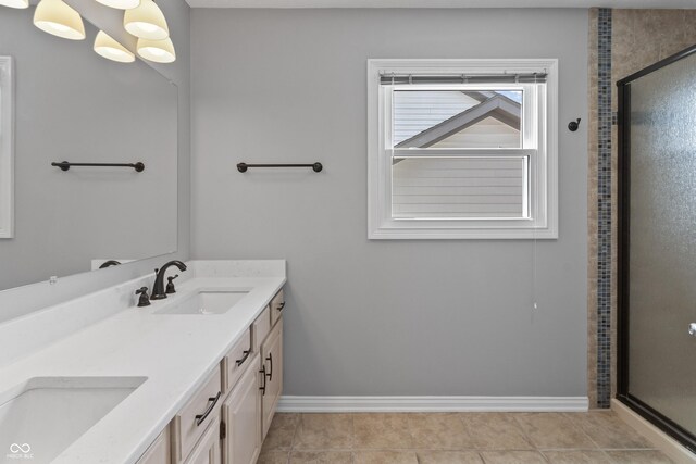 11226 Blackwalnut Pt, Indianapolis, IN 46236 - full bathroom featuring a shower stall, baseboards, and double vanity