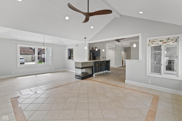 11226 Blackwalnut Pt, Indianapolis, IN 46236 - unfurnished living room featuring inlaid floor details, light tile patterned floors, ceiling fan, beamed ceiling, and baseboards