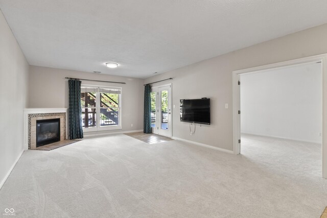 11226 Blackwalnut Pt, Indianapolis, IN 46236 - unfurnished living room with carpet floors, baseboards, and a tile fireplace