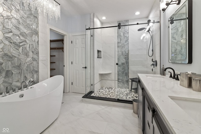 11226 Blackwalnut Pt, Indianapolis, IN 46236 - bathroom featuring a stall shower, marble look tile flooring, double vanity, recessed lighting, and a freestanding tub