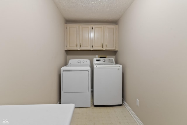 11226 Blackwalnut Pt, Indianapolis, IN 46236 - laundry area with cabinet space, independent washer and dryer, light flooring, and a textured ceiling