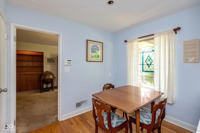 7401 Spring Mill Rd, Indianapolis, IN 46260 - dining area featuring baseboards and light wood-type flooring