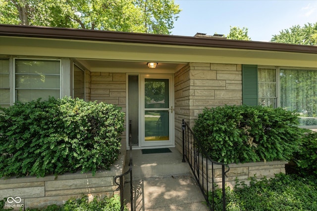 7401 Spring Mill Rd, Indianapolis, IN 46260 - doorway to property with stone siding