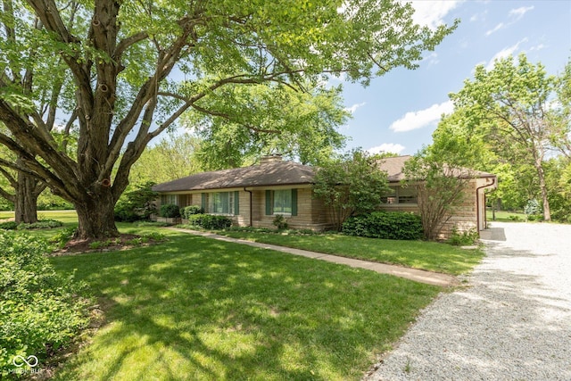 7401 Spring Mill Rd, Indianapolis, IN 46260 - ranch-style home featuring a front yard, gravel driveway, and a chimney