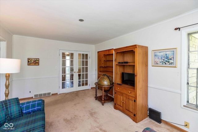 7401 Spring Mill Rd, Indianapolis, IN 46260 - living room with french doors, light colored carpet, and crown molding