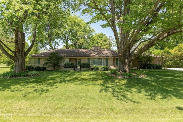 7401 Spring Mill Rd, Indianapolis, IN 46260 - single story home with a front yard and a chimney