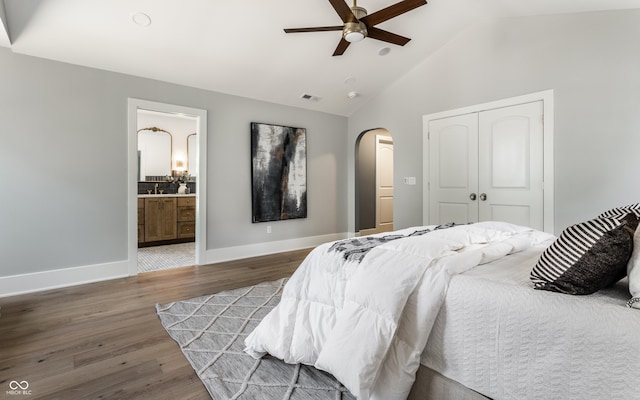 5682 Broadway St, Indianapolis, IN 46220 - bedroom with arched walkways, a closet, wood finished floors, baseboards, and ceiling fan