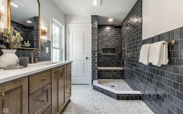 5682 Broadway St, Indianapolis, IN 46220 - full bath with a tile shower, double vanity, and tile walls