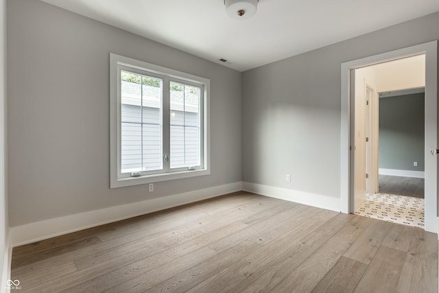 5682 Broadway St, Indianapolis, IN 46220 - spare room with light wood-type flooring and baseboards
