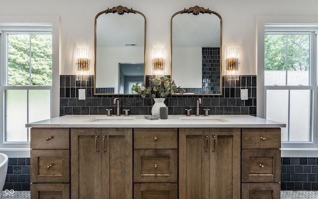 5682 Broadway St, Indianapolis, IN 46220 - full bathroom with healthy amount of natural light, backsplash, and double vanity