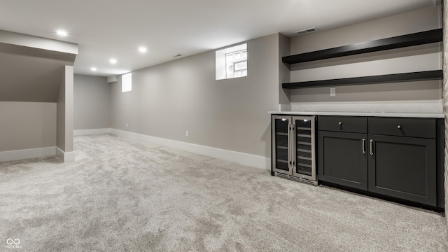 5682 Broadway St, Indianapolis, IN 46220 - indoor dry bar featuring wine cooler, light colored carpet, plenty of natural light, recessed lighting, and baseboards