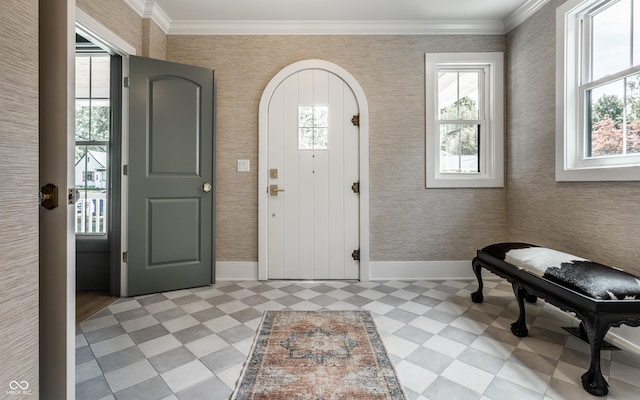 5682 Broadway St, Indianapolis, IN 46220 - foyer entrance with light floors, healthy amount of natural light, baseboards, and ornamental molding