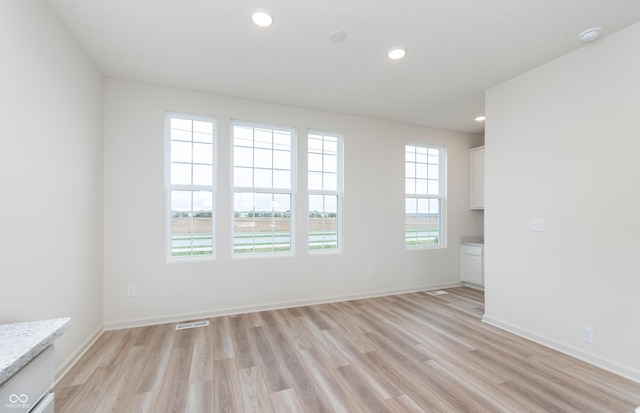 14515 Hanford Ln, Carmel, IN 46074 - spare room with light wood-type flooring, recessed lighting, baseboards, and a smoke detector