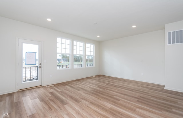 14515 Hanford Ln, Carmel, IN 46074 - empty room featuring light wood-type flooring, recessed lighting, and baseboards