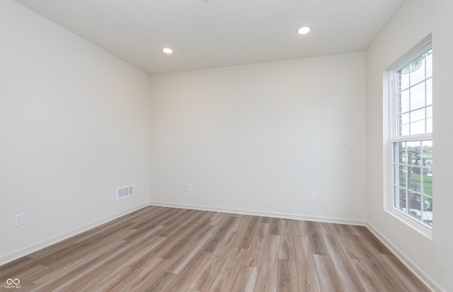 14515 Hanford Ln, Carmel, IN 46074 - unfurnished room featuring healthy amount of natural light, light wood-style floors, recessed lighting, and baseboards