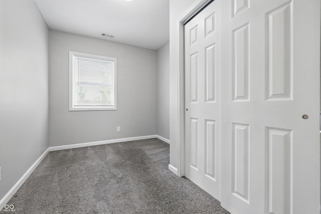 2030 Houston St, Indianapolis, IN 46218 - unfurnished bedroom with carpet floors, baseboards, and a closet