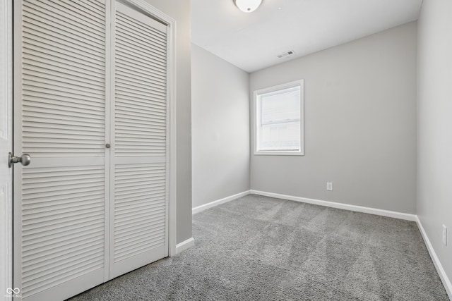 2030 Houston St, Indianapolis, IN 46218 - unfurnished bedroom with carpet floors, a closet, and baseboards