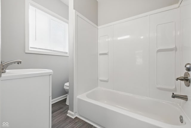 2030 Houston St, Indianapolis, IN 46218 - full bath featuring toilet, wood finished floors, baseboards, shower / bath combination, and vanity