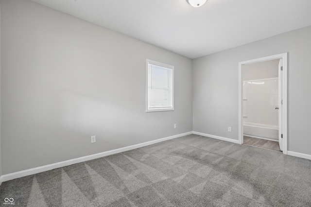 2030 Houston St, Indianapolis, IN 46218 - spare room featuring carpet flooring and baseboards