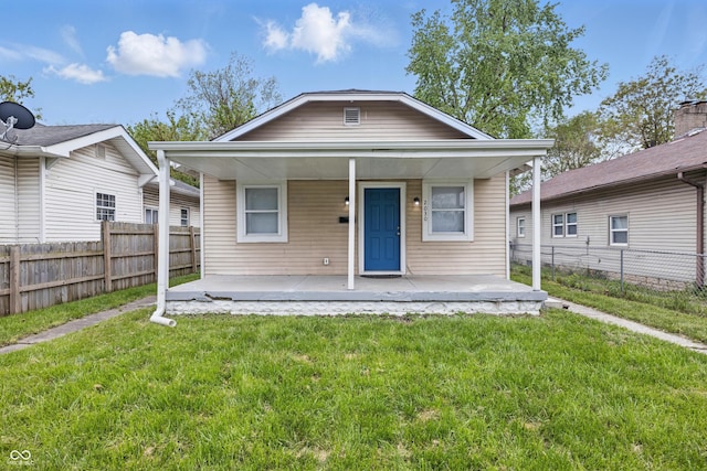 2030 Houston St, Indianapolis, IN 46218 - shotgun-style home featuring covered porch