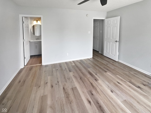10366 Camby Xing, Fishers, IN 46038 - unfurnished bedroom with wood finished floors, baseboards, and connected bathroom