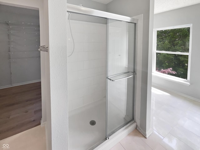 10366 Camby Xing, Fishers, IN 46038 - full bath featuring a stall shower, baseboards, and tile patterned flooring