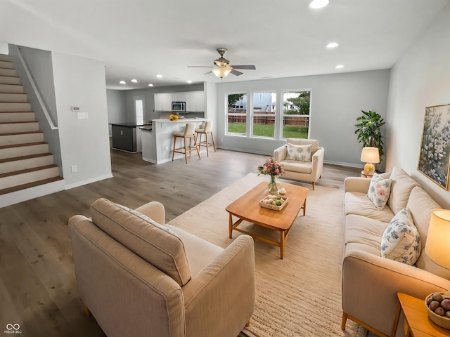 10366 Camby Xing, Fishers, IN 46038 - living room with recessed lighting, stairway, ceiling fan, baseboards, and light wood-style flooring