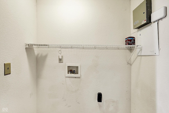 clothes washing area featuring hookup for a washing machine