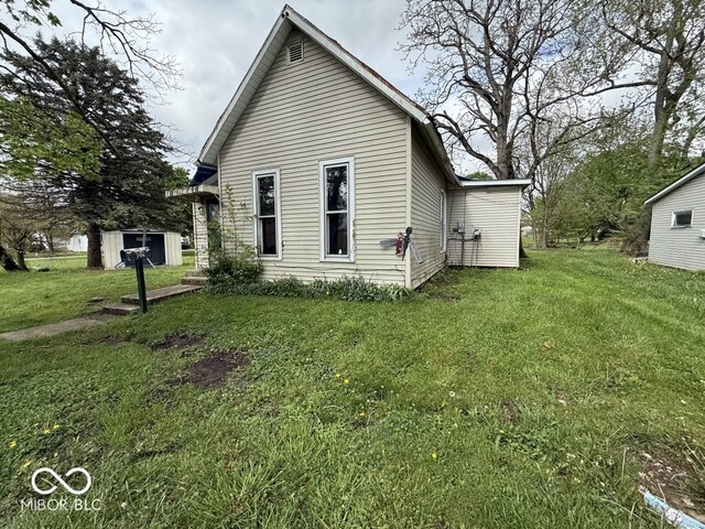 105 N Sheridan St, Ridgeville, IN 47380 - back of property with a yard and an outbuilding