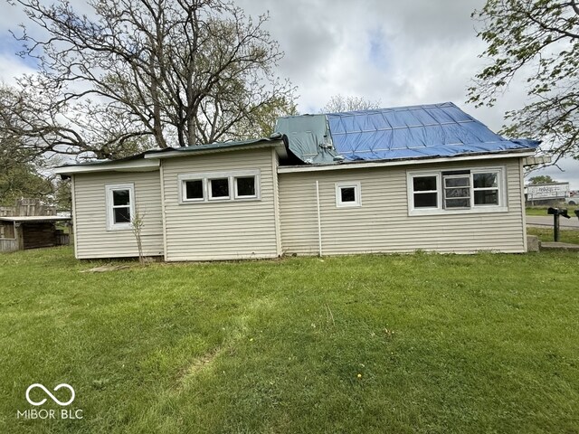 105 N Sheridan St, Ridgeville, IN 47380 - rear view of house featuring a yard and metal roof