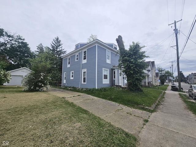 view of side of property featuring a yard