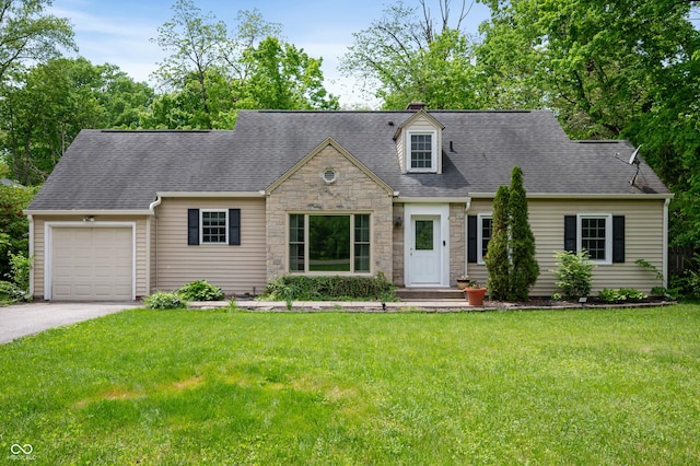 7910 N College Ave, Indianapolis, IN 46240 - cape cod home with stone siding, a garage, driveway, and a front lawn