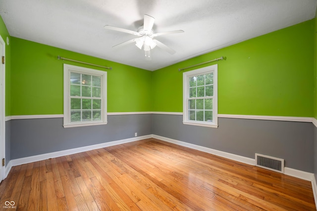 7910 N College Ave, Indianapolis, IN 46240 - unfurnished room featuring hardwood / wood-style floors, a ceiling fan, and baseboards