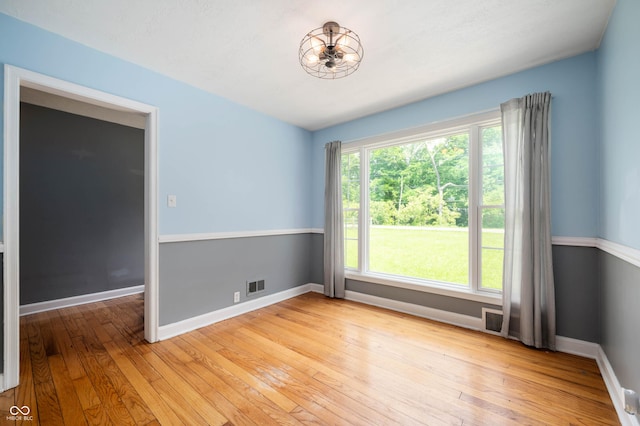 7910 N College Ave, Indianapolis, IN 46240 - empty room featuring light wood finished floors and baseboards
