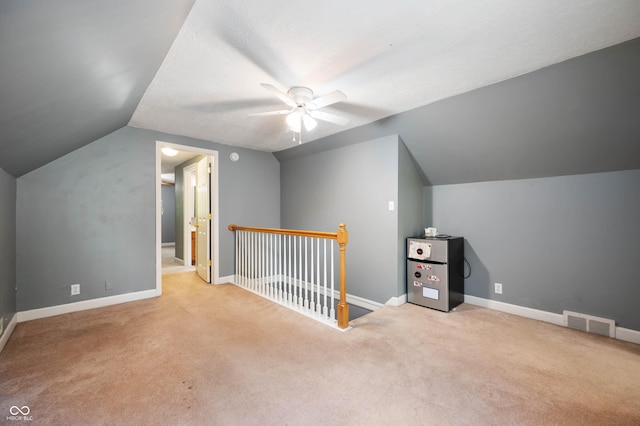 7910 N College Ave, Indianapolis, IN 46240 - additional living space with ceiling fan, carpet flooring, lofted ceiling, and baseboards