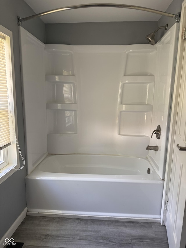 3342 Foltz St, Indianapolis, IN 46221 - full bath featuring bathtub / shower combination, wood finished floors, and baseboards