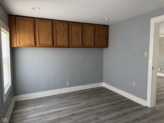 3342 Foltz St, Indianapolis, IN 46221 - unfurnished room featuring dark wood-style flooring, plenty of natural light, baseboards, and recessed lighting