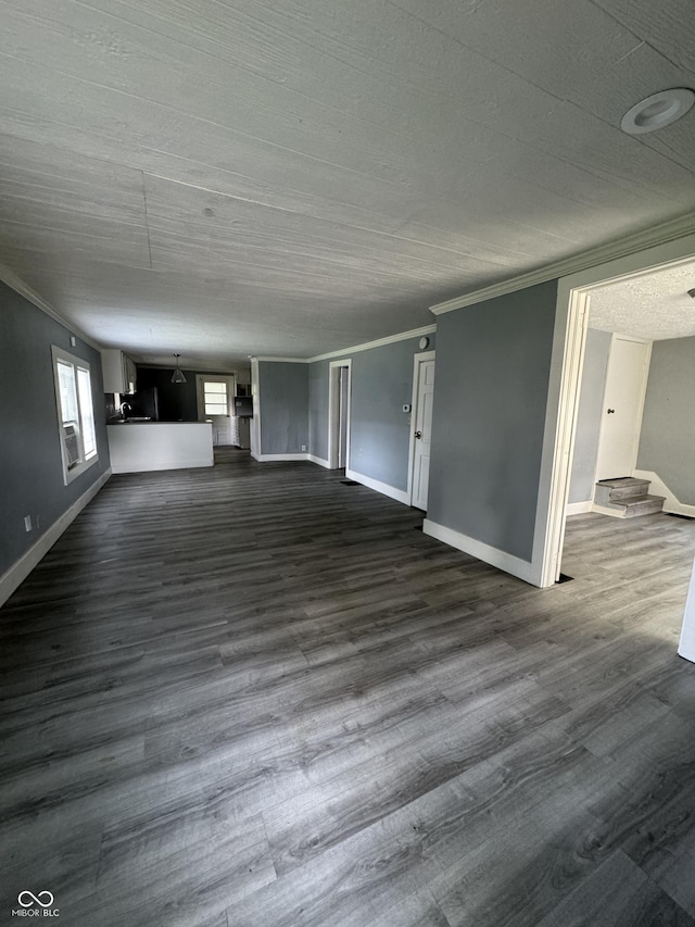 3342 Foltz St, Indianapolis, IN 46221 - unfurnished living room with ornamental molding, baseboards, dark wood finished floors, and stairs