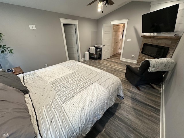 29 Victory, Coatesville, IN 46121 - bedroom featuring wood finished floors, baseboards, a fireplace, vaulted ceiling, and ceiling fan