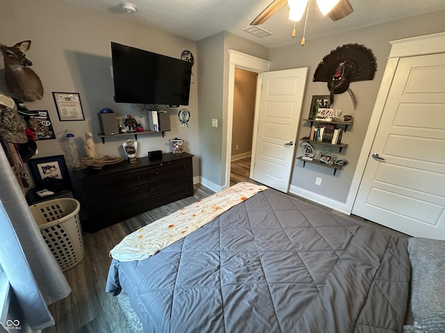 29 Victory, Coatesville, IN 46121 - bedroom with dark wood-type flooring, baseboards, and ceiling fan
