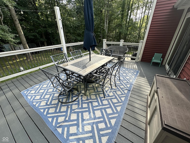 29 Victory, Coatesville, IN 46121 - wooden deck with outdoor dining space and view of scattered trees