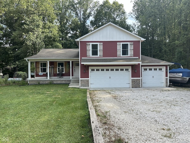 29 Victory, Coatesville, IN 46121 - tri-level home with a front yard, driveway, a porch, an attached garage, and stone siding