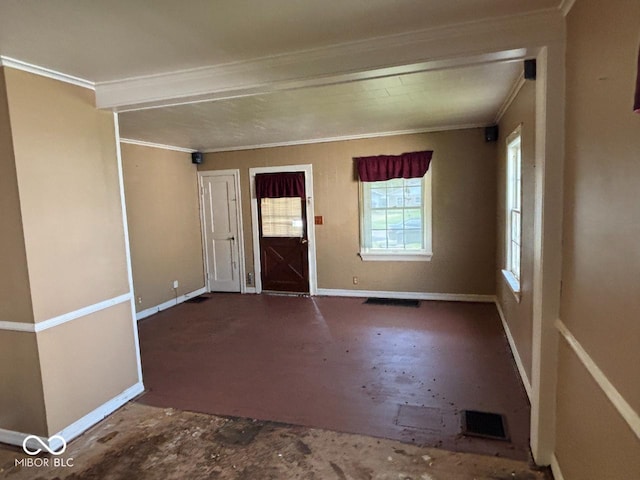 entrance foyer featuring ornamental molding and baseboards