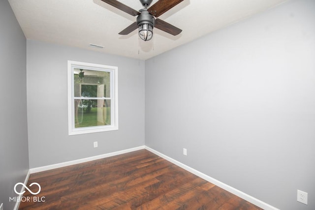 6805 N Base Rd, North Vernon, IN 47265 - empty room featuring baseboards, dark wood-style flooring, and ceiling fan
