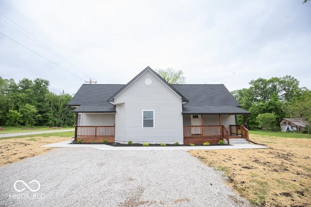 6805 N Base Rd, North Vernon, IN 47265 - view of front of house featuring covered porch and a shingled roof