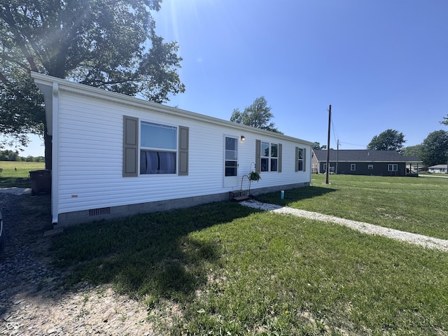 216 E Wabash St, Wingate, IN 47994 - manufactured / mobile home featuring crawl space and a front lawn