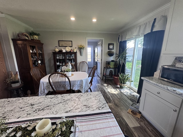 216 E Wabash St, Wingate, IN 47994 - dining space with dark wood-style floors, crown molding, and recessed lighting